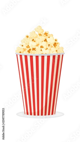A red and white striped bucket filled with fluffy yellow popcorn