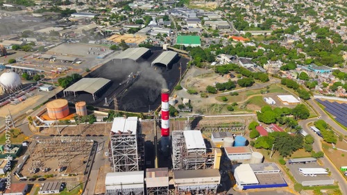 Aerial view of industrial power plant with smokestack and energy infrastructure