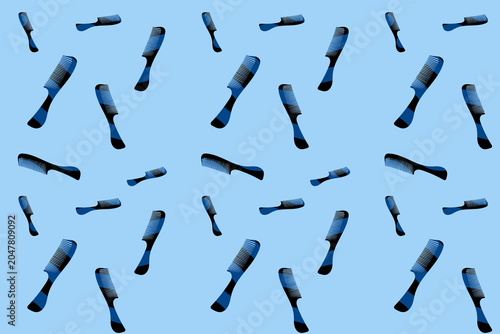 Repeating pattern of barber combs on a blue background in a modern and minimalist style
