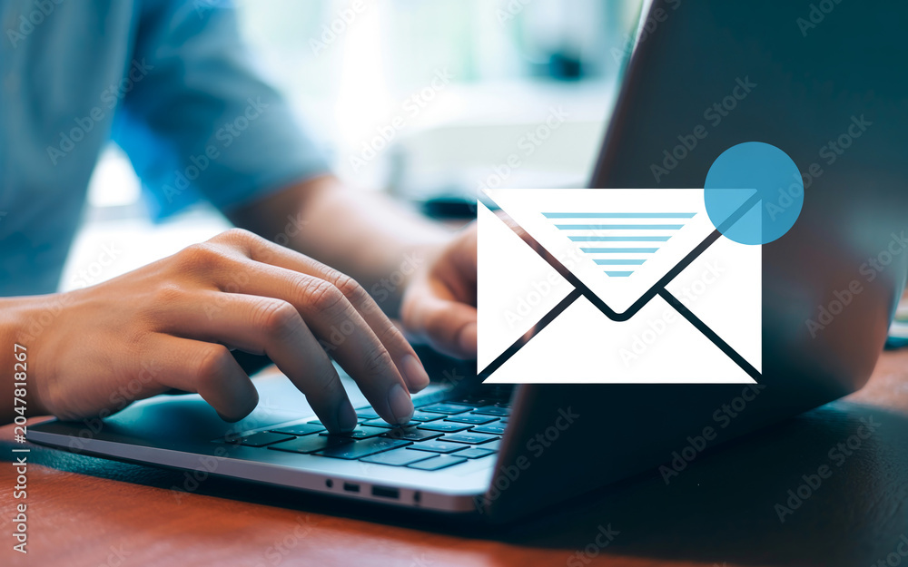Naklejka premium Email communication and digital messaging on laptop keyboard.