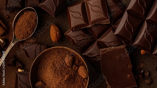 Dark Chocolate Background with Cocoa Powder, Cocoa Nibs and Almonds, Top View, Copy Space