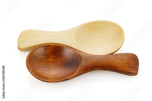 Small wooden spoon for spice isolated on white background. Close-up