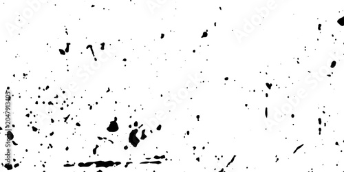 A black ink splat and splash design creates a textured grunge pattern with paint drops and liquid splatter art on a light background