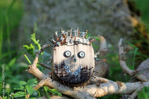 Tableau sur toile Wooden head with nails and more