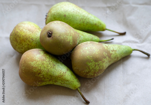 Fresh Green Pears Arranged on Neutral Paper Still Life Close-Up for Food and Produce