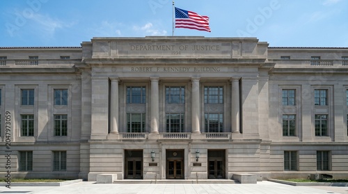 United States Department of Justice building with flying flag. Government institution exterior in Washington. Federal law and legal office headquarters for criminal and civil justice.