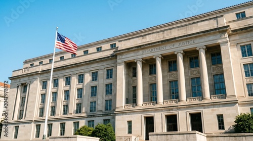 Department of Justice building in Washington DC with waving American flag. Governmental administrative headquarters for federal law enforcement and legal system in the United States.