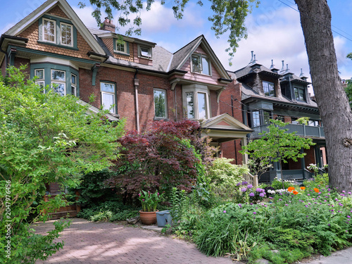 Fotografía Residential street with old semi-detached houses with gables and dormer windows