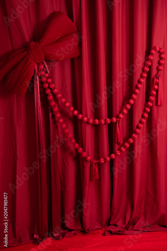 red velvet curtain with gold ribbon
