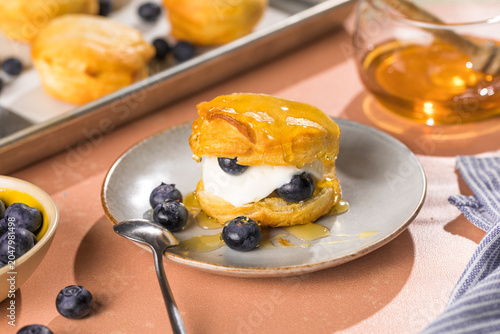 Scone Filled with Blueberry  and Clotted Cream on a plate
