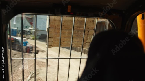 Excavator Bucket Viewed from Inside Operator Cab at Construction Site