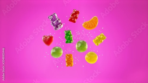 Colorful gummy bear candies, hard candies, and sweet fruit slices float mid-air surrounded by scattered sugar crystals. This vibrant 3D rendering represents confectionery, confectionery treats, junk f