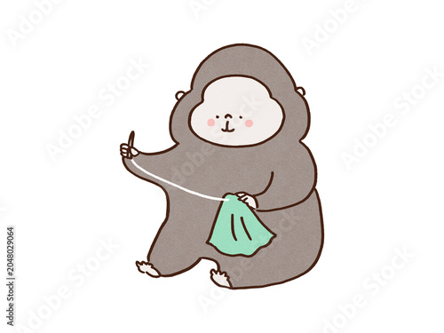 Fotografie Gorilla carefully sewing a piece of cloth with a needle and thread, delicate wor