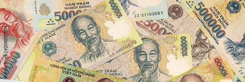 фотографія Vietnamese dong money bills in pile on table