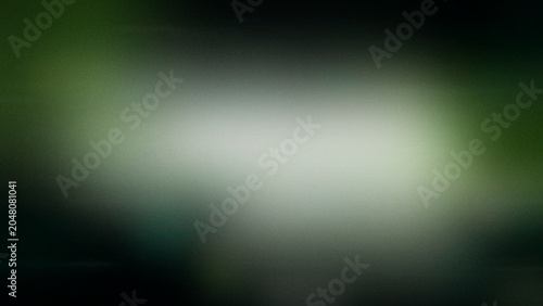 Valokuva A diffuse white spotlight haze fades into deep green and near-black tones, creating a calm, cinematic mood for presentations, overlays, and UI backgrounds