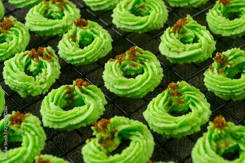 Photos Kue sagu pandan keju, delicious ring shaped green pandan cookies with brown suga