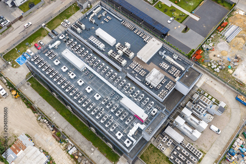 Aerial view of the Datacenter T-Mobile building featuring rows of cooling units and industrial equipment on the rooftop Warszawa, Wojewodztwo mazowieckie, Poland.