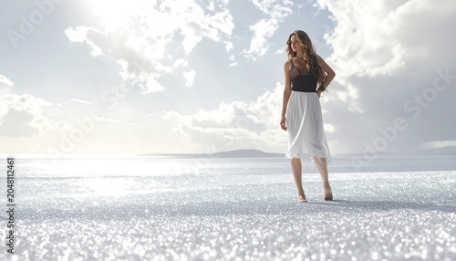 A woman in a white skirt and top stands on a sparkling, reflective plain under a cloudy sky