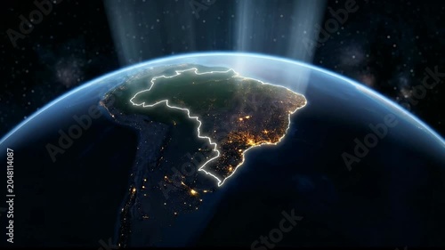 Planet Earth curve at night with glowing Brazil outline city lights and light rays in space