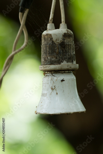Old light bulb sockets and worn-out light bulbs.