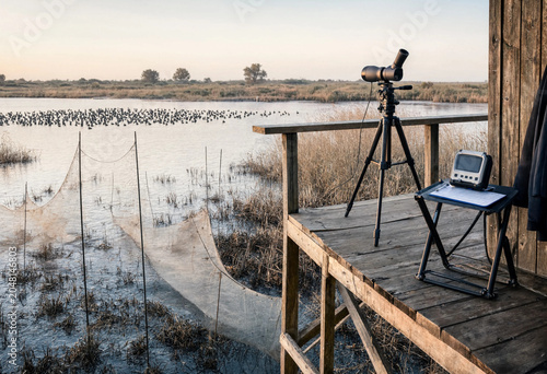 Billede på lærred A bird research observation platform with a spotting scope on a tripod and a sma