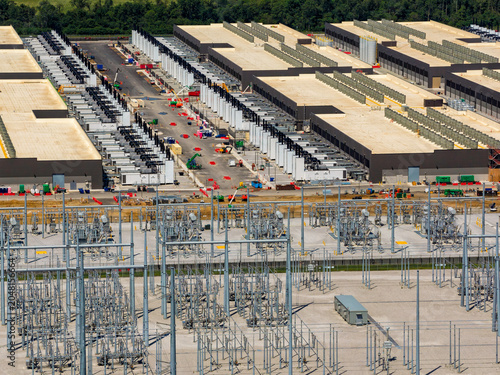 Aerial view of the data ai center buildings and power station, energy source in the foreground