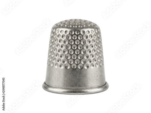 Classic silver metal thimble with a dimpled surface perfect for sewing and crafting projects, isolated on transparent background