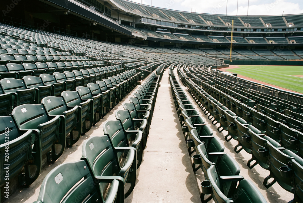 Fototapeta premium Rows of empty green seating in professional sports stadium arena
