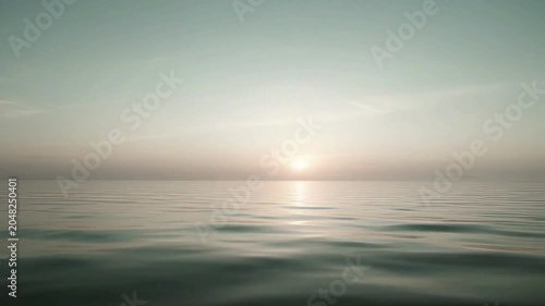 Sunset over calm ocean water.