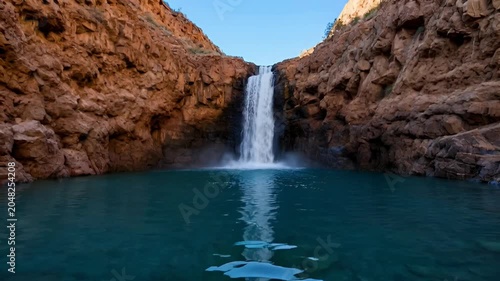 Waterfall in Rocky Mountain Landscape.