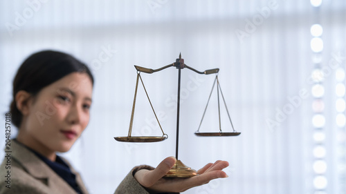 Obraz na plátne Asian businesswoman lawyer holding balance scale justice law symbol concept repr