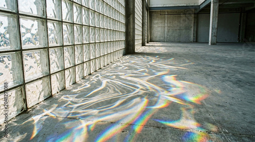 Abstract Sunlight Patterns on Concrete Floor from Glass Blocks