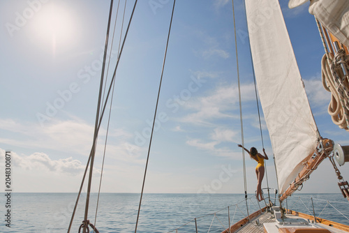 Relax, travel and freedom with woman on yacht for summer vacation, sea journey and peace. Holiday getaway, tropical adventure and sailing with person on boat for cruise, tourism and transport