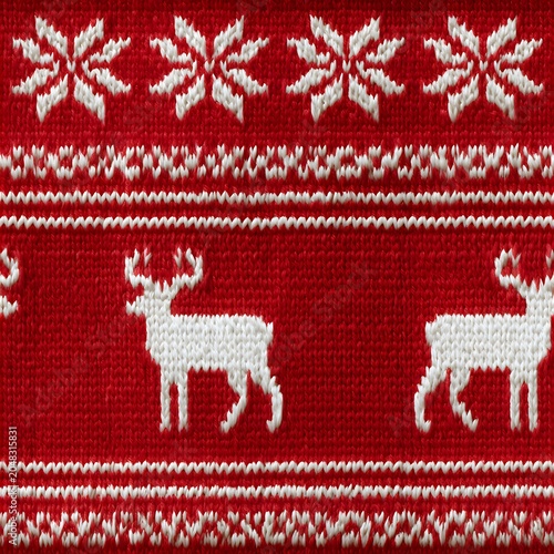Detailed red knitted fabric featuring traditional white winter reindeer and snowflake patterns