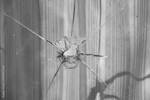 broken glass. Hole glass shot. Close up