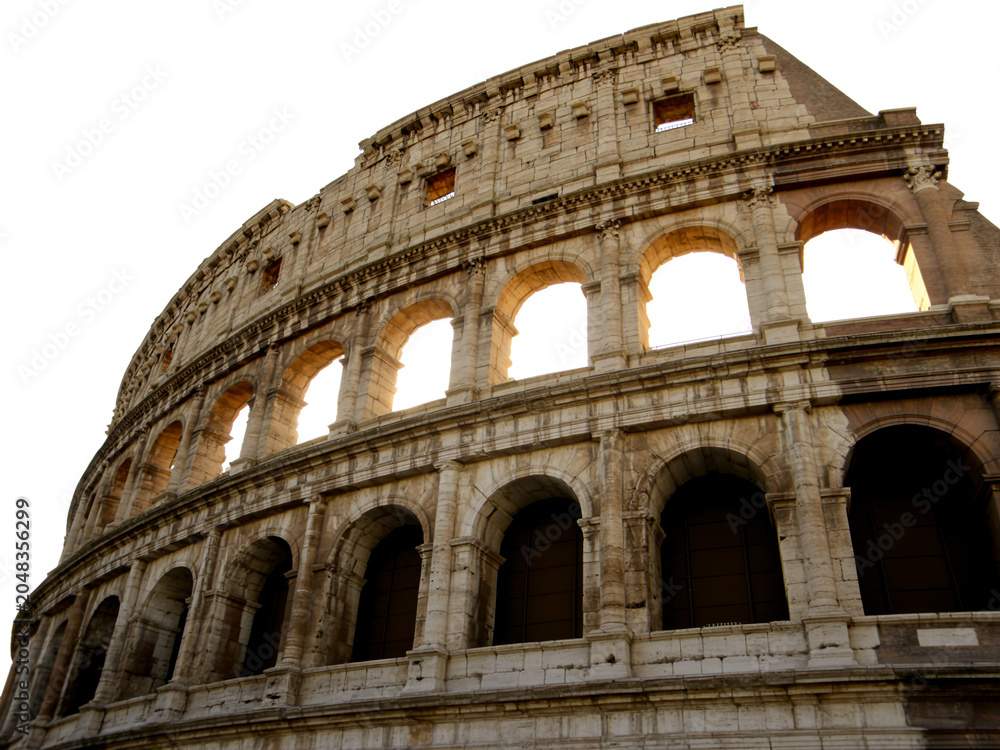 Fototapeta premium Iconic Roman Colosseum Architectural Marvel with Arches and Arcadestones, a Historic Amphitheater and Landmark