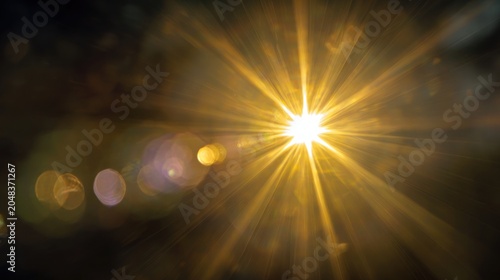 Bright sunlight burst with abstract lens flares and beams in a dark background
