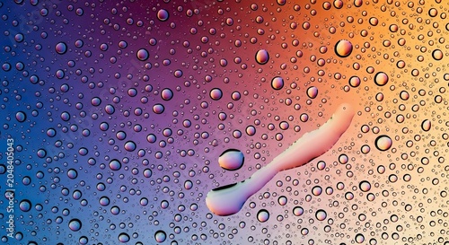 Abstract macro photography of water droplets on colorful surface