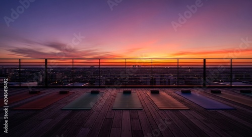 Serene Rooftop Yoga Session at Sunset Overlooking Cityscape.