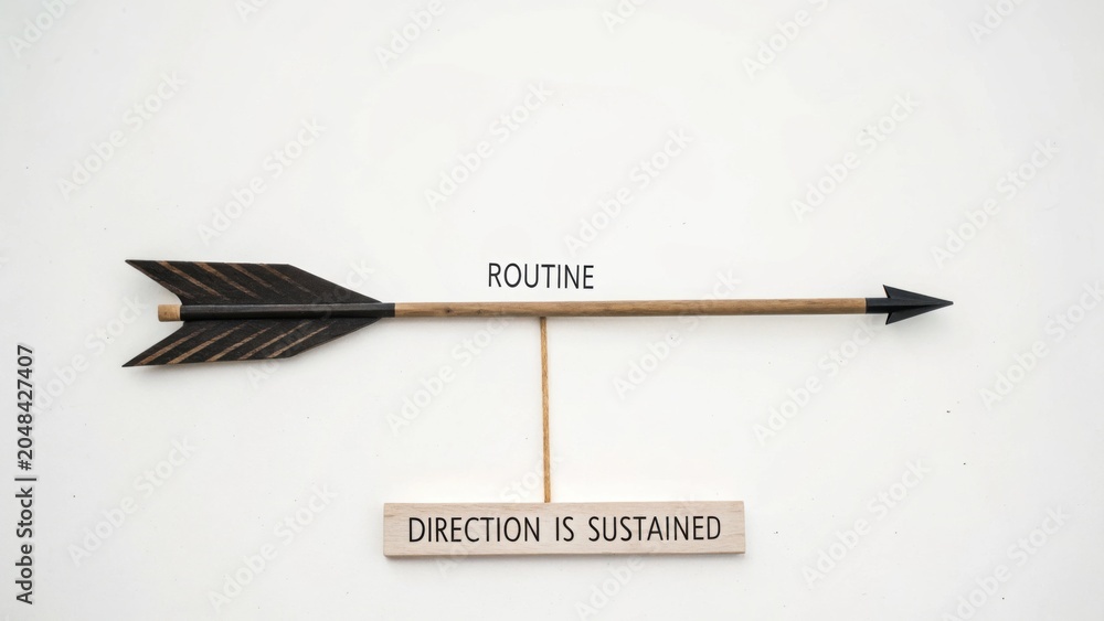 Naklejka premium Arrow with Inspirational Message on Routine and Direction Sustainment for Motivational Stock Imagery