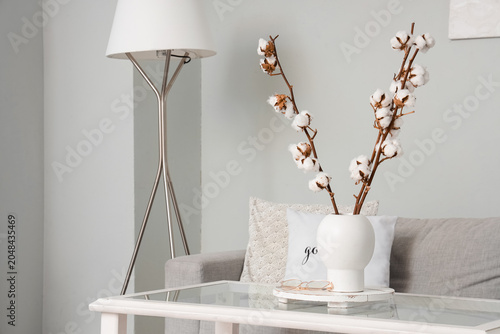 Vase with cotton flowers an...