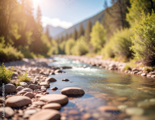 A scenic river trekking path alongside a crystal clear river, with lush greenery on both sides and rocky terrain. Selective focus.