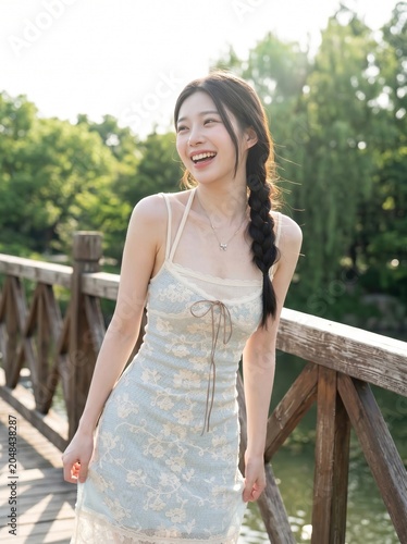 Joyful Summer Day: A young woman with a radiant smile enjoys a warm summer day, her braided hair cascading over her shoulder as she stands on a wooden bridge surrounded by lush greenery and sunlight