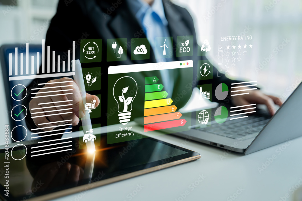 Fototapeta premium A business professional analyzes energy efficiency data using advanced digital tools and interactive charts, emphasizing the importance of sustainable practices and innovative solutions. Ledger