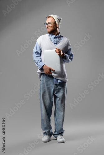 Stylish young man in eyegla...
