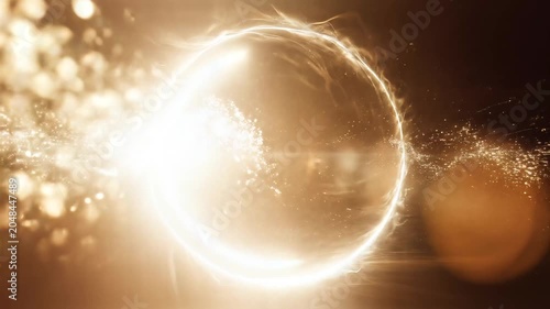 Abstract glowing ring with light particles and energy waves in dark space