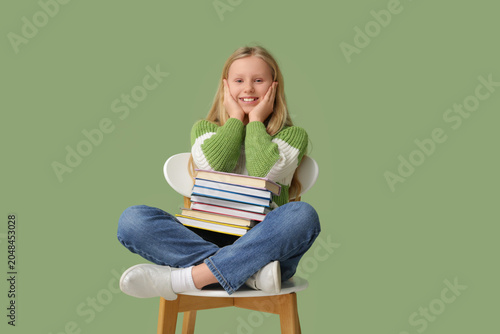 Cute little girl with books...
