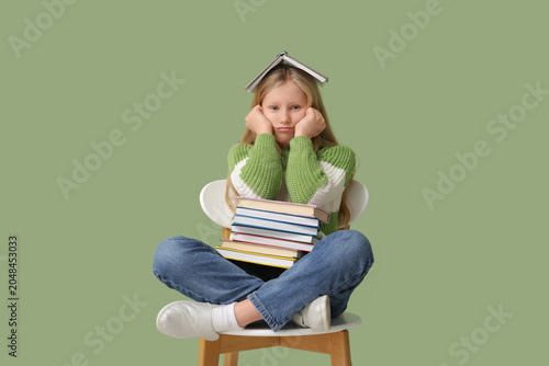 Cute little girl with books...