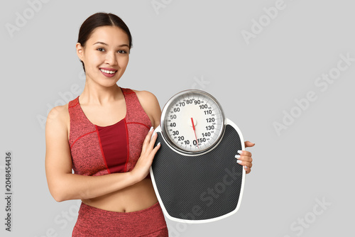Young woman in sportswear a...