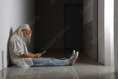 Depressed mature woman with...